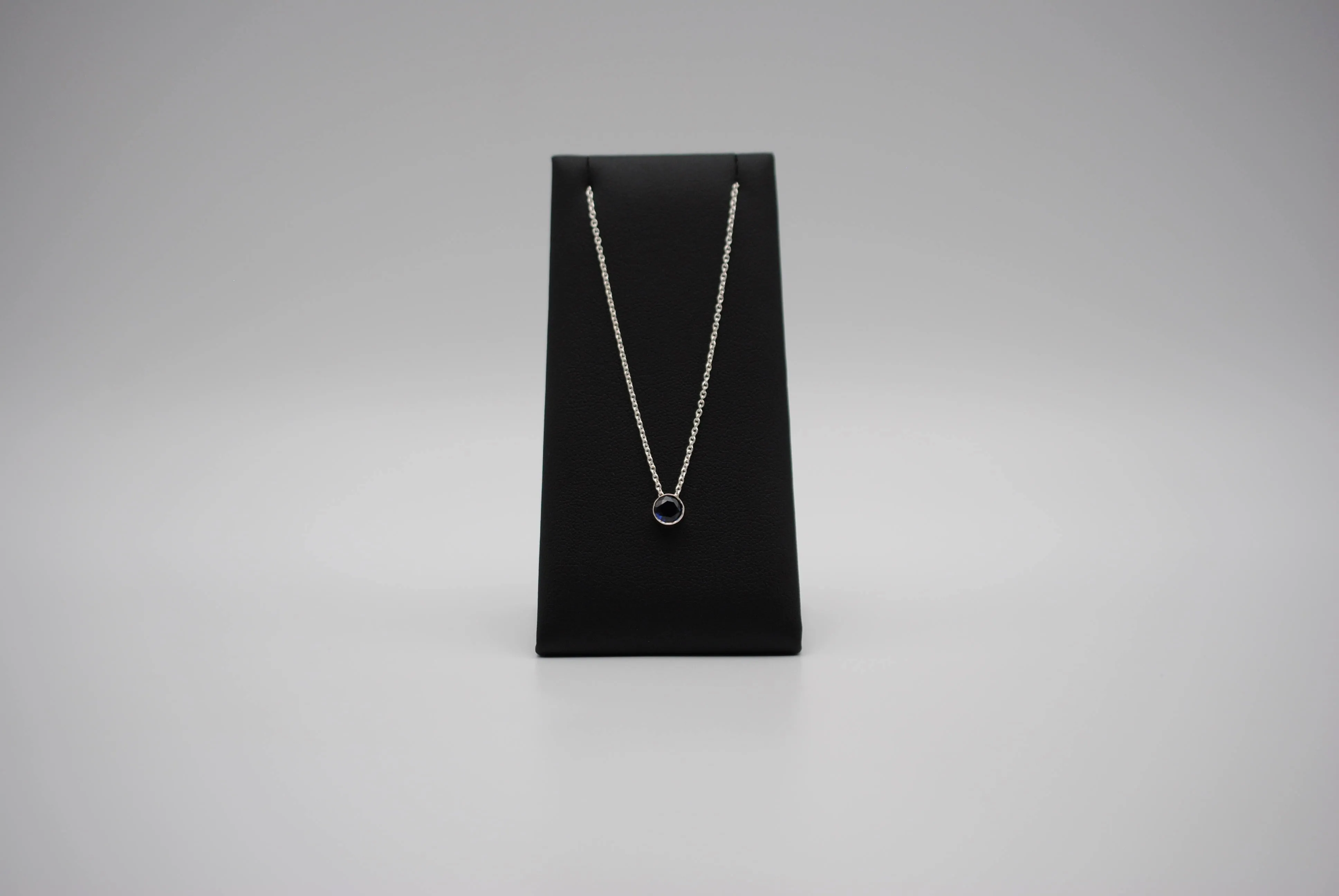 Birthstone Necklace: Round Sapphire, Silver Bezel, on Cable Chain